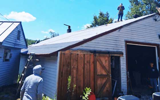 LaVorgna Construction crew member working on a roof